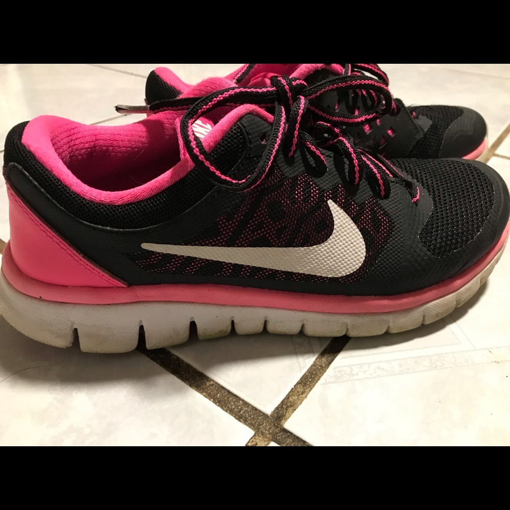 Pink and black Nike shoes